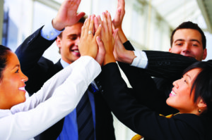 Business group doing the high five